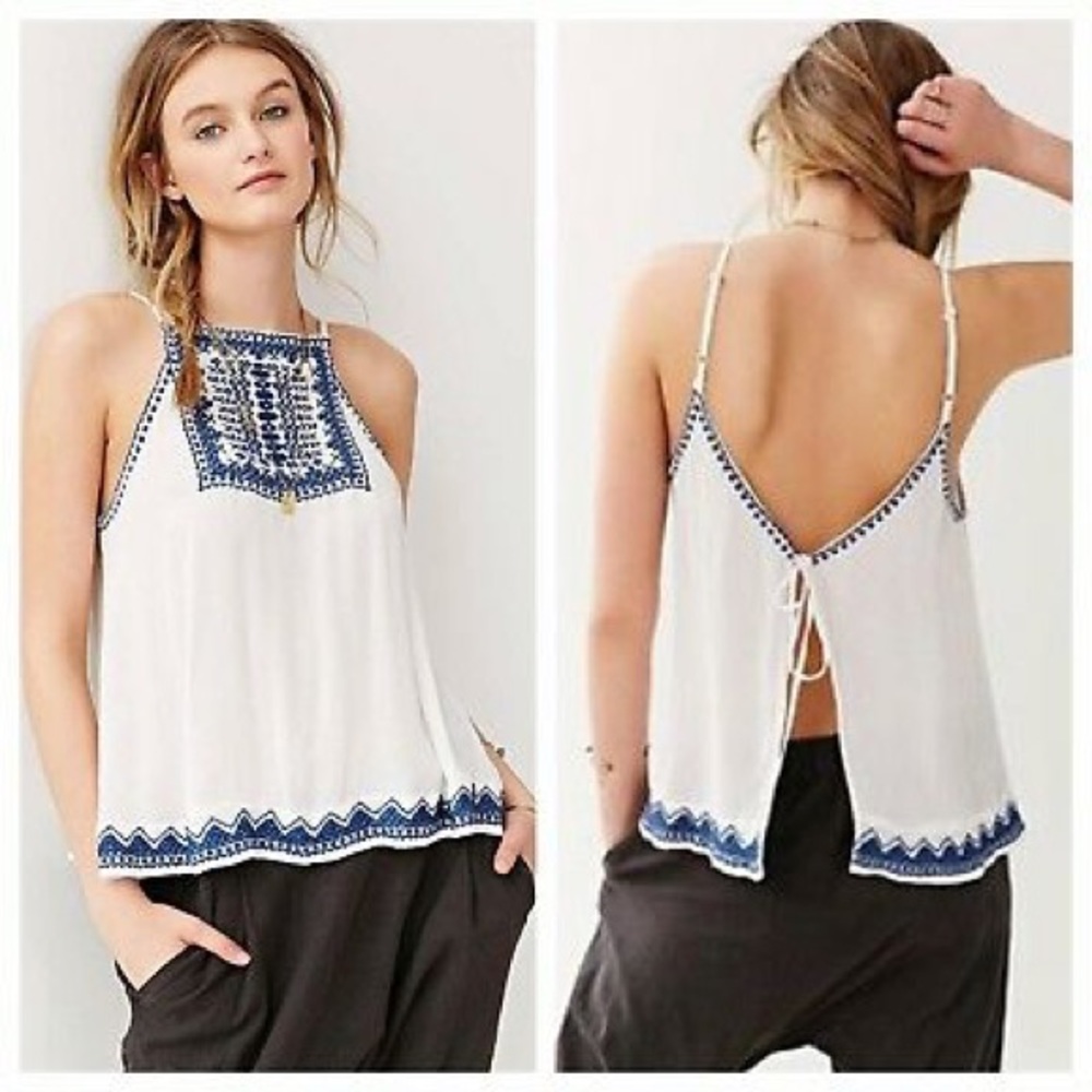 White tank top with blue embroidering